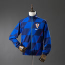 CHAQUETA CORTAVIENTOS REVERSIBLE CROACIA 2026